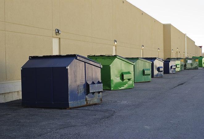 a row of large construction dumpsters on-site in Argenta, IL